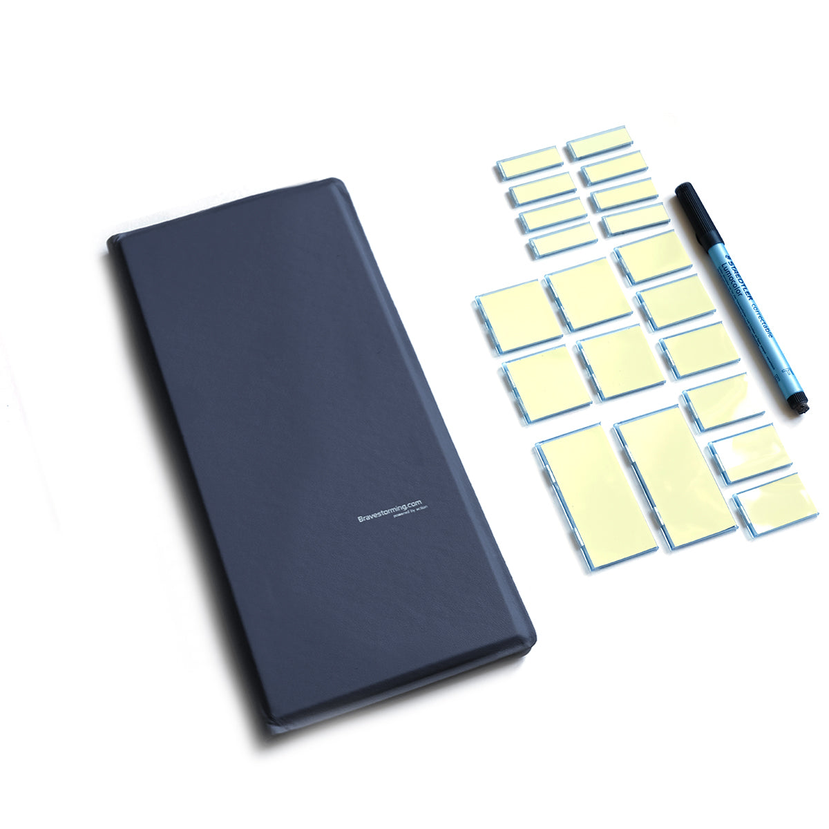 Blue notebook with sticky notes and a pen on a white background