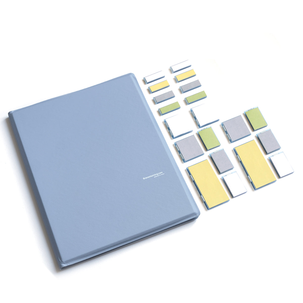 Blue notebook with colorful square stickers on a white background